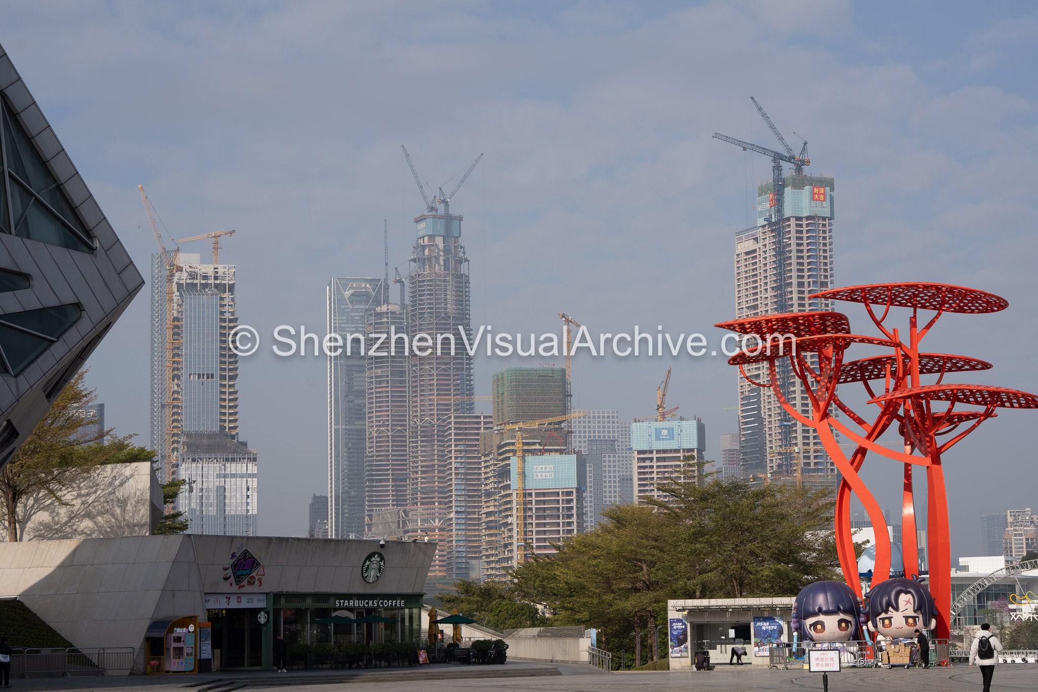 OCT Harbour Plaza Framing Hongshuwan Skyline with DJI Architecture and Red Installation (SVA-26-0045)