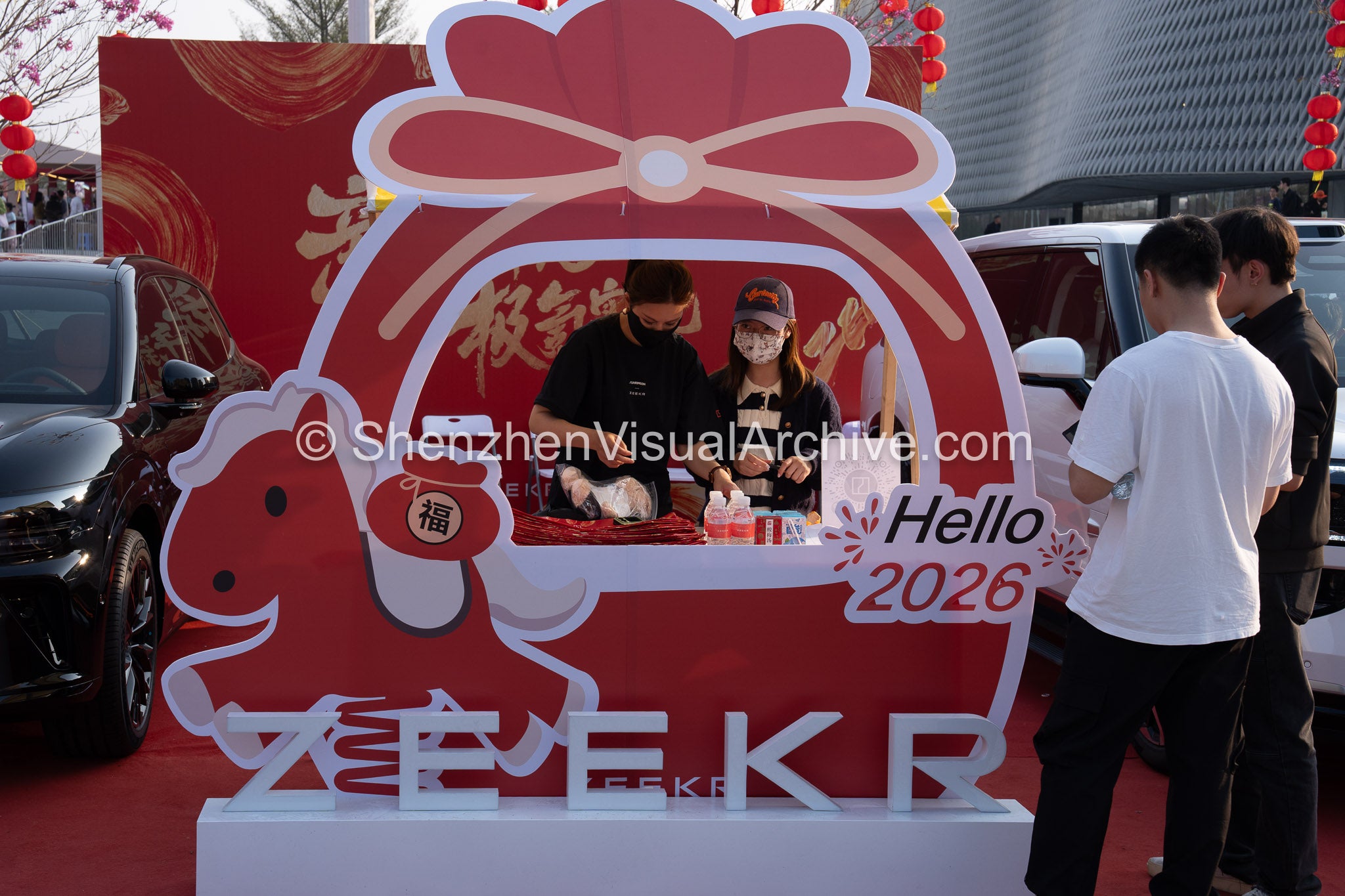 Brand Engagement: Staff Preparing Gifts at the ZEEKR 2026 Flower Fair Booth (SVA-26-0079)