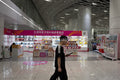 Subterranean Retail: Commuter at the National Games Licensed Store in Gangxia North (SVA-26-0085)