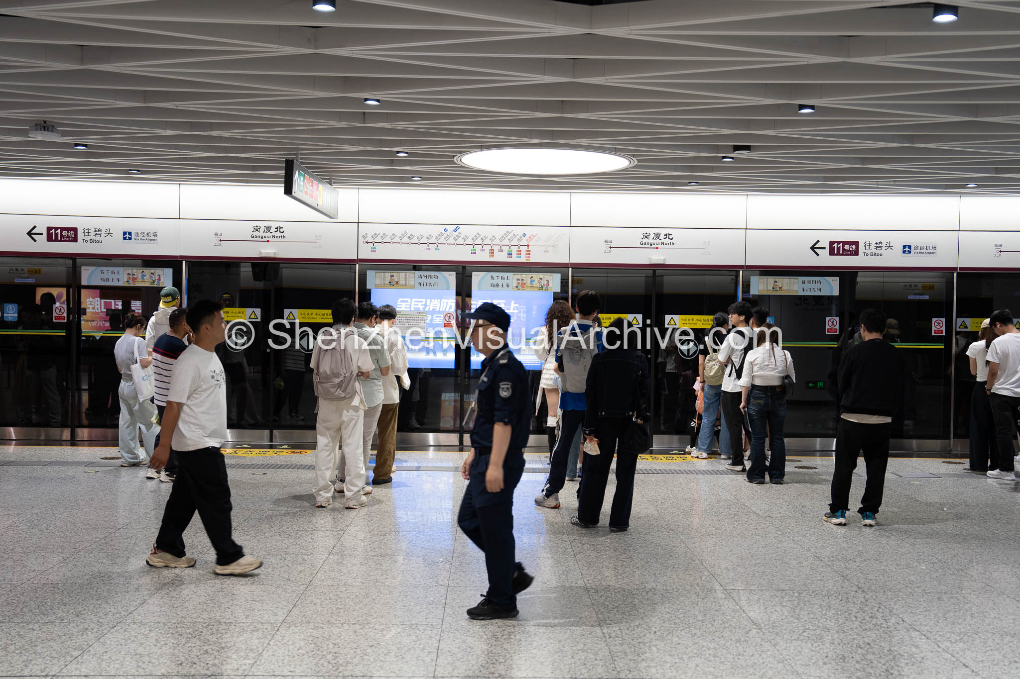 Organized Transit: Commuters Queuing for Line 11 at Gangxia North Station (SVA-26-0088)
