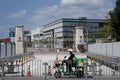 Urban Rhythm: Courier Passing the SUSTech Main Gate at Nanshan (SVA-26-0160)