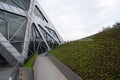 Architectural Landscape: Organic Facade and Sloped Green Roof Ramp at DJI Hasselblad Flagship Store (SVA-26-0167)