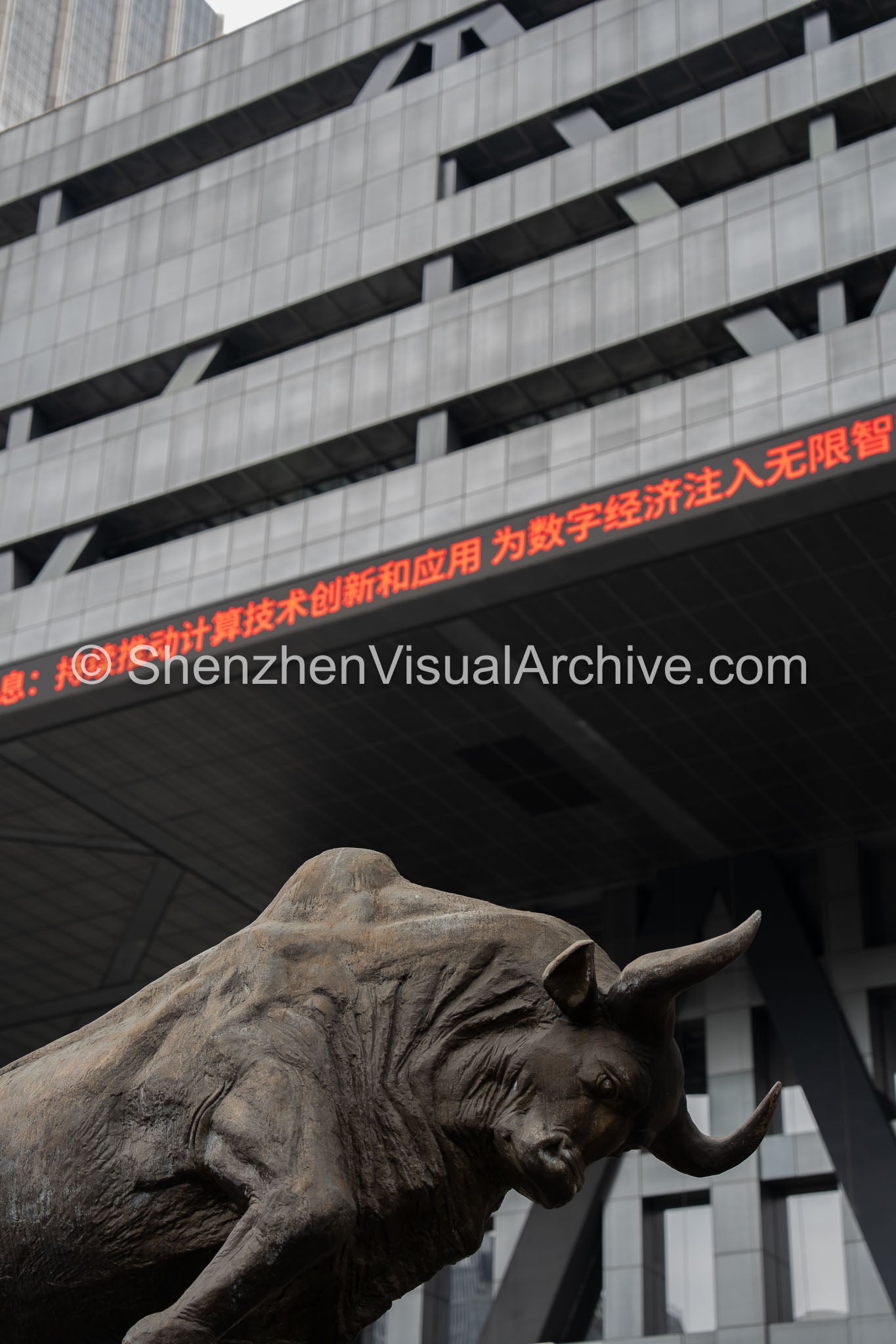 Financial Power: Low Angle Charging Bull and Red LED Banner at Shenzhen Stock Exchange (SVA-26-0190)