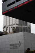 Financial District: Rising Bull Sculpture above Shenzhen Stock Exchange Identity Wall and Red Ticker (SVA-26-0192)