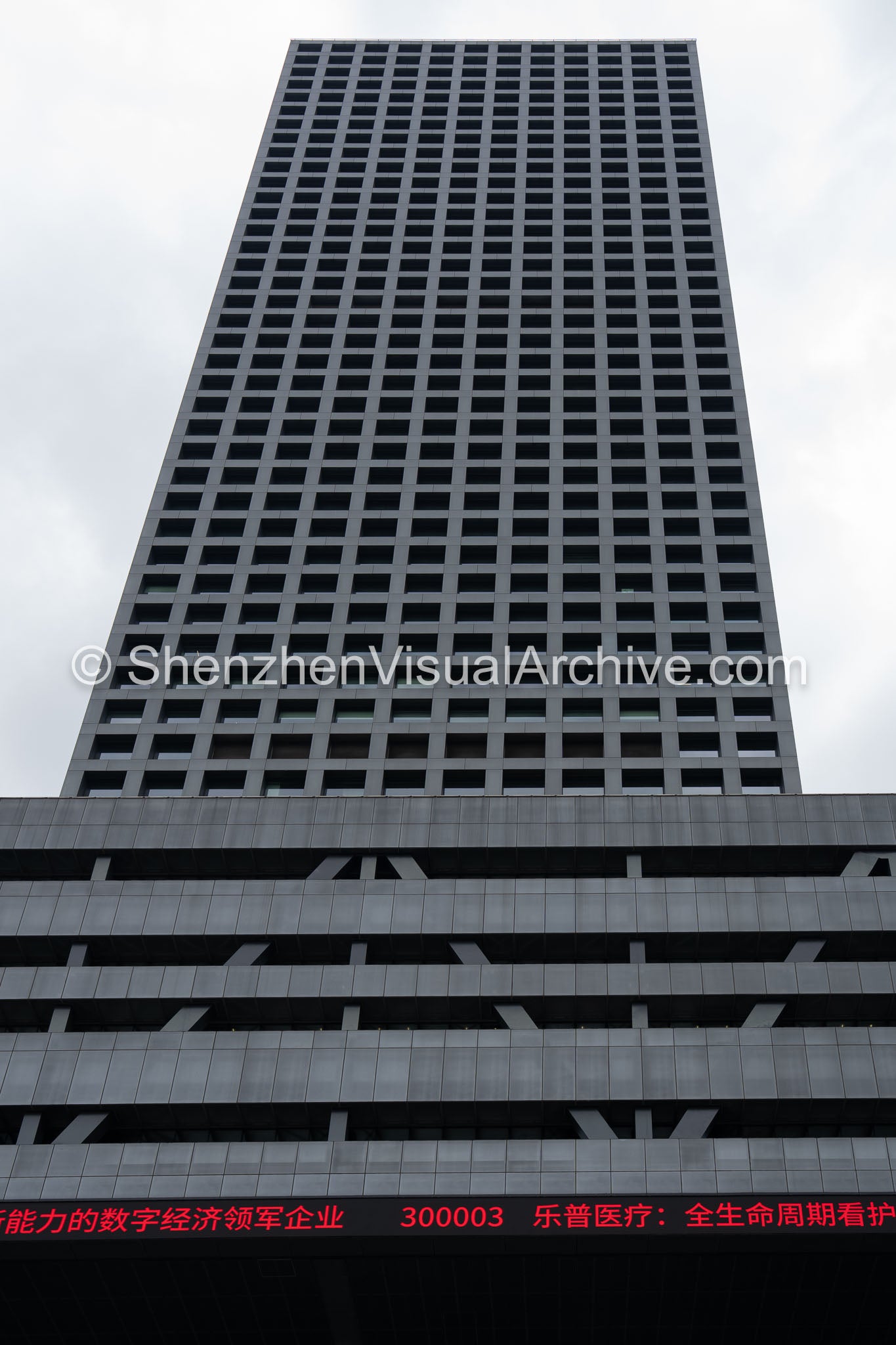 Low-Angle Upward View of Shenzhen Stock Exchange Tower and Red Ticker (SVA-26-0193)