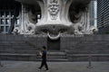 Urban Life: Pedestrian Walking Past Monumental Sculpture Base at Shenzhen Stock Exchange (SVA-26-0194)