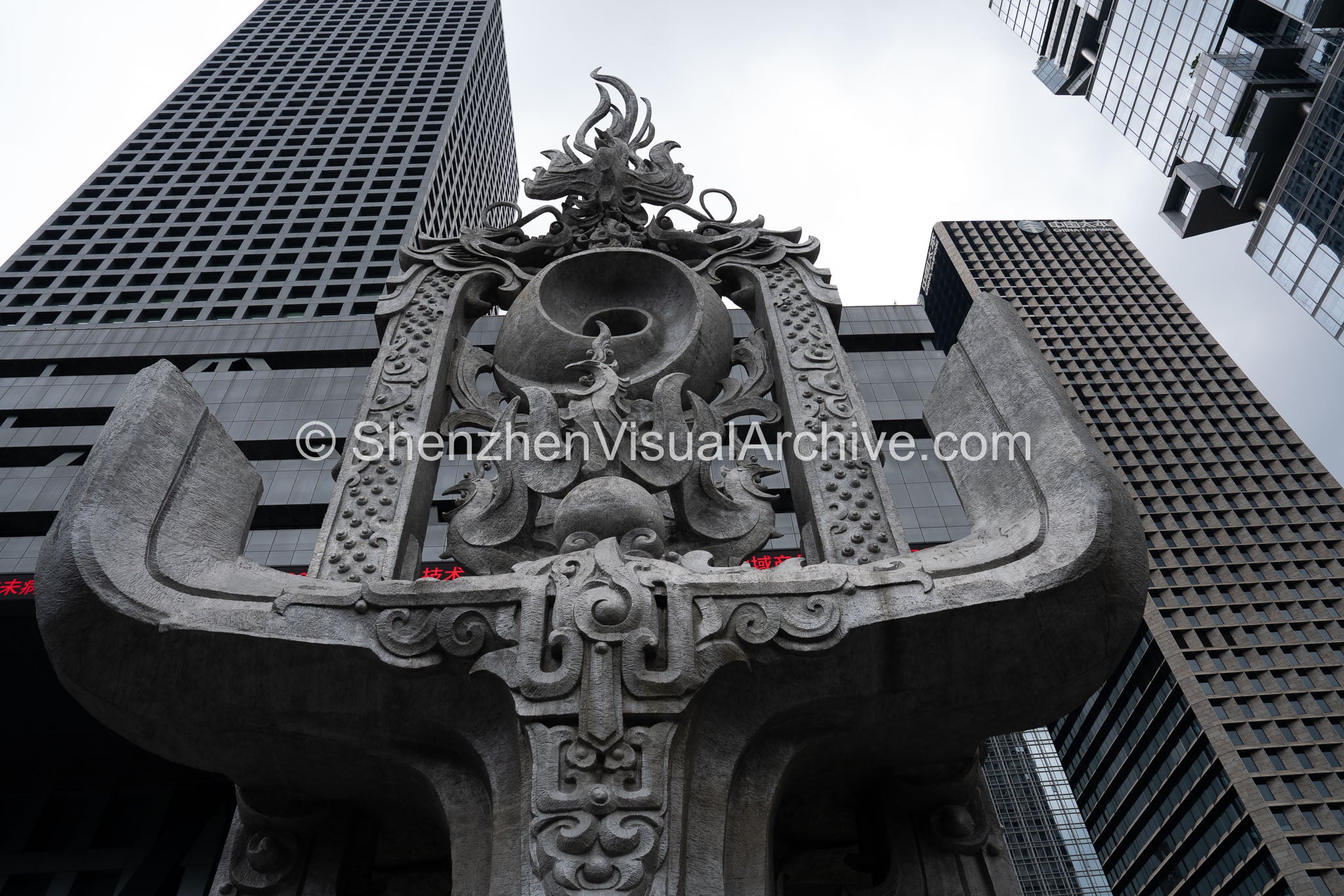 Monumental Public Art: Extreme Low-Angle Perspective of Shenzhen Stock Exchange Sculpture and Futian CBD Skyline (SVA-26-0195)